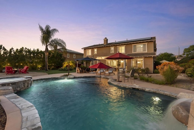 11550 Carowind Ln, Scripps Miramar, CA 92131 - pool at dusk featuring a patio, a gazebo, a pool with connected hot tub, and outdoor dining space