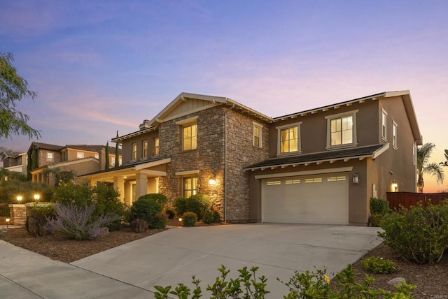 11550 Carowind Ln, Scripps Miramar, CA 92131 - view of front of property with an attached garage, driveway, stucco siding, and stone siding