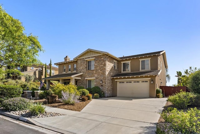 11550 Carowind Ln, Scripps Miramar, CA 92131 - view of front of house with an attached garage, stone siding, driveway, and stucco siding