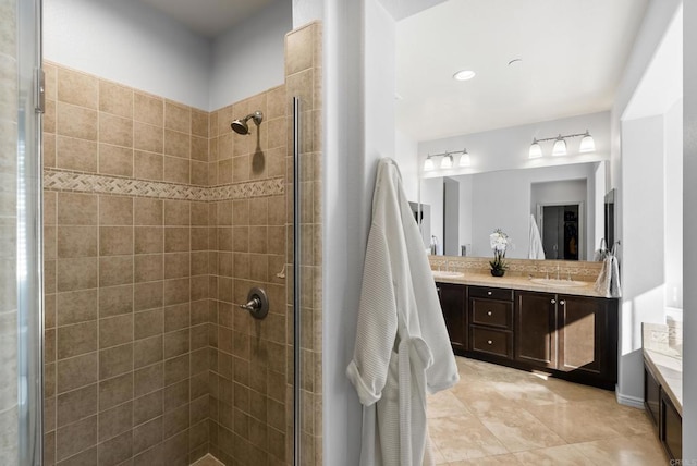11550 Carowind Ln, Scripps Miramar, CA 92131 - full bathroom with double vanity, tiled shower, and tile patterned flooring