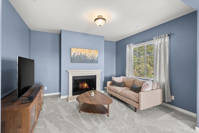 11550 Carowind Ln, Scripps Miramar, CA 92131 - carpeted living area with baseboards and a warm lit fireplace