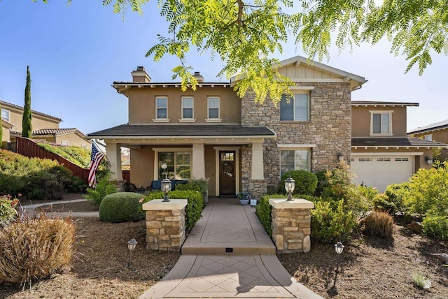 11550 Carowind Ln, Scripps Miramar, CA 92131 - view of front of property with stone siding, stucco siding, an attached garage, and a chimney