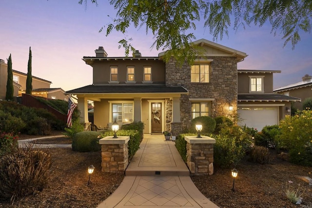 11550 Carowind Ln, Scripps Miramar, CA 92131 - view of front of property with stucco siding, stone siding, covered porch, and an attached garage