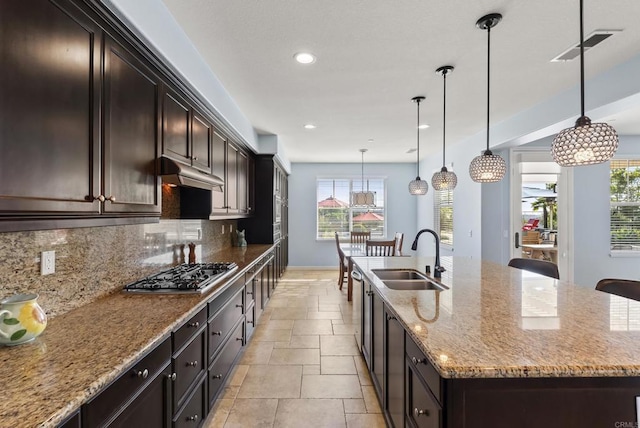 11550 Carowind Ln, Scripps Miramar, CA 92131 - kitchen featuring stainless steel gas stovetop, stone tile floors, plenty of natural light, decorative backsplash, and recessed lighting