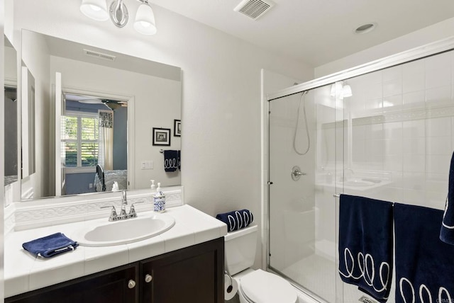 11550 Carowind Ln, Scripps Miramar, CA 92131 - bathroom with vanity, a shower stall, and a ceiling fan