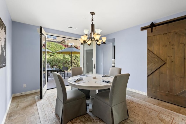 11550 Carowind Ln, Scripps Miramar, CA 92131 - dining area with a chandelier, light stone finish flooring, and a barn door