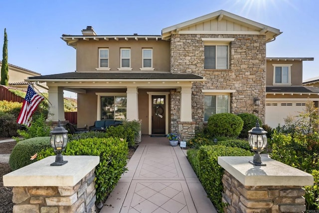 11550 Carowind Ln, Scripps Miramar, CA 92131 - view of front of home featuring stone siding, stucco siding, an attached garage, and a chimney