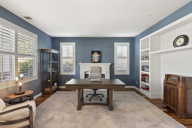 11550 Carowind Ln, Scripps Miramar, CA 92131 - office with healthy amount of natural light, wood finished floors, and built in features