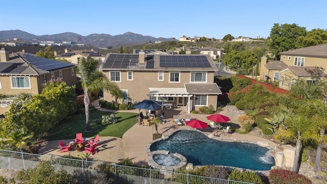 11550 Carowind Ln, Scripps Miramar, CA 92131 - rear view of property featuring a residential view, a patio area, a mountain view, stucco siding, and a pool with connected hot tub