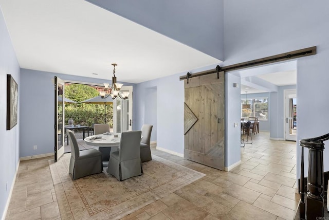 11550 Carowind Ln, Scripps Miramar, CA 92131 - dining space with a barn door, plenty of natural light, and a chandelier