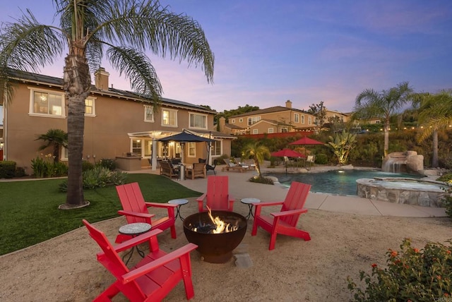 11550 Carowind Ln, Scripps Miramar, CA 92131 - view of pool with an outdoor fire pit, a patio, a pool with connected hot tub, and a yard