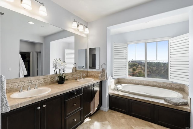 11550 Carowind Ln, Scripps Miramar, CA 92131 - full bath featuring double vanity, a bath, and tile patterned flooring
