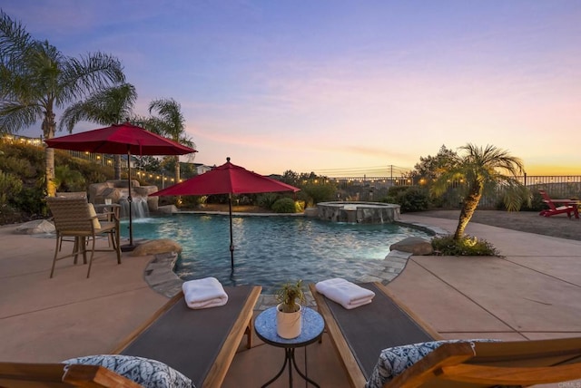 11550 Carowind Ln, Scripps Miramar, CA 92131 - pool at dusk with a patio area and a pool with connected hot tub