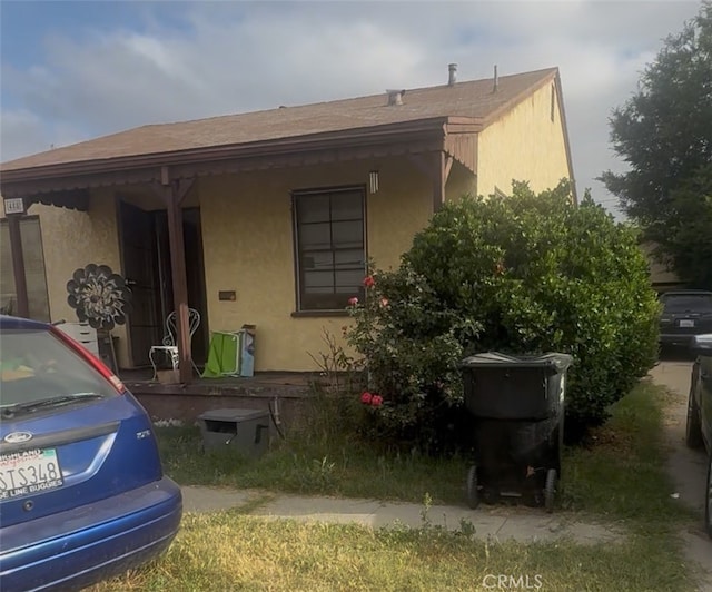 488 E Evans St, San Bernardino, CA 92404 - view of front facade with stucco siding and a shingled roof