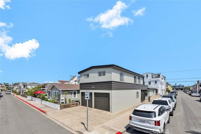 300 34th St, Newport Beach, CA 92663 - view of asphalt street with sidewalks, a residential view, curbs, traffic signs, and street lighting