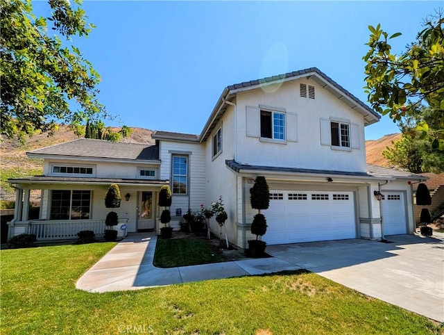 1971 Mesa Dr, Colton, CA 92324 - traditional-style house featuring an attached garage, concrete driveway, a front yard, a porch, and stucco siding
