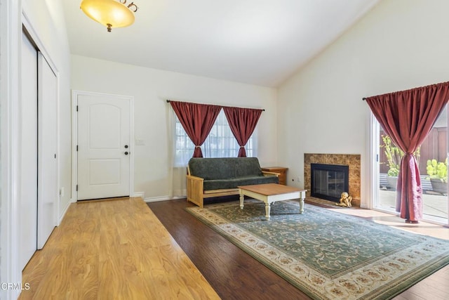 552 Cayo Grande Ct, Newbury Park, CA 91320 - living area featuring wood finished floors, vaulted ceiling, and a fireplace