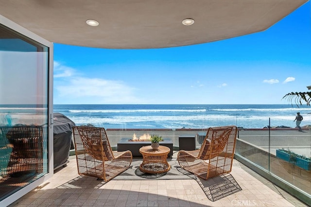 516 S The Strand # A, Oceanside, CA 92054 - balcony featuring a water view and an outdoor living space with a fire pit