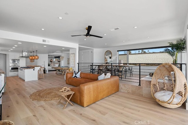 516 S The Strand # A, Oceanside, CA 92054 - living room with light wood-style floors, ceiling fan, and recessed lighting