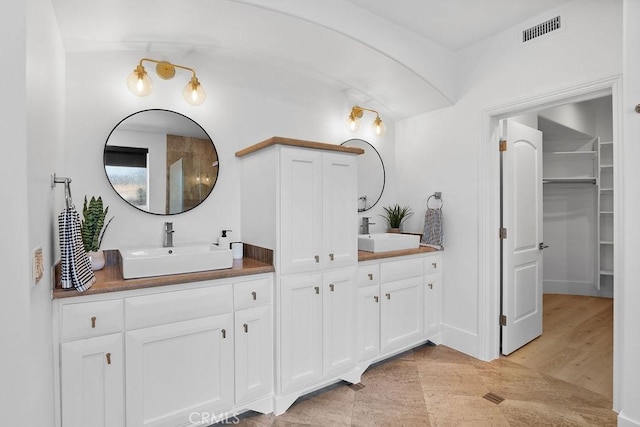 516 S The Strand # A, Oceanside, CA 92054 - bathroom with double vanity and a spacious closet