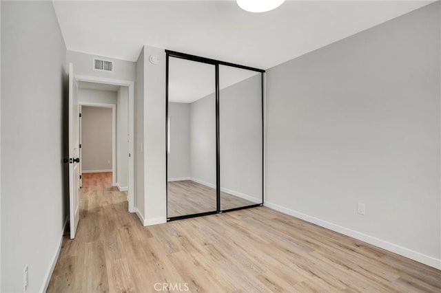 10555 Vassar Ave, Chatsworth, CA 91311 - unfurnished bedroom featuring light wood-type flooring and a closet