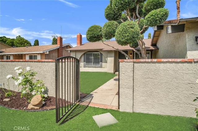 10555 Vassar Ave, Chatsworth, CA 91311 - view of front of house featuring stucco siding, a gate, and a chimney