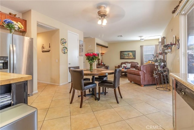 2168 Stonewood St, Mentone, CA 92359 - dining space with light tile patterned floors and ceiling fan