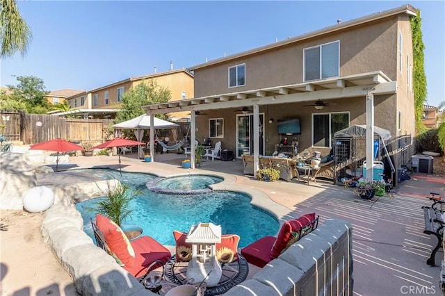 2168 Stonewood St, Mentone, CA 92359 - view of swimming pool featuring ceiling fan, a pool with connected hot tub, and a patio