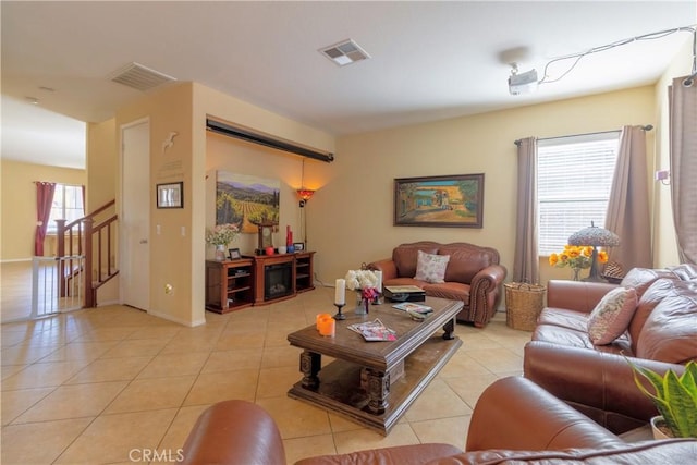 2168 Stonewood St, Mentone, CA 92359 - living room with light tile patterned floors and stairway