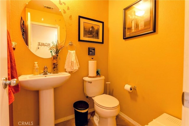 2168 Stonewood St, Mentone, CA 92359 - half bath featuring toilet and tile patterned flooring