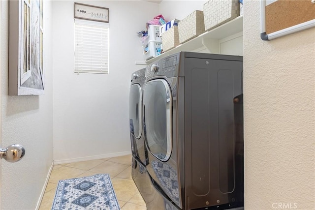 2168 Stonewood St, Mentone, CA 92359 - laundry room featuring washing machine and clothes dryer and light tile patterned floors