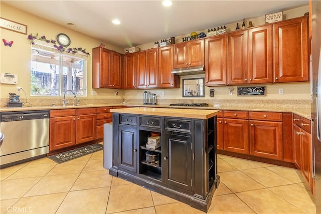 2168 Stonewood St, Mentone, CA 92359 - kitchen with stainless steel dishwasher, under cabinet range hood, gas stovetop, recessed lighting, and light tile patterned flooring