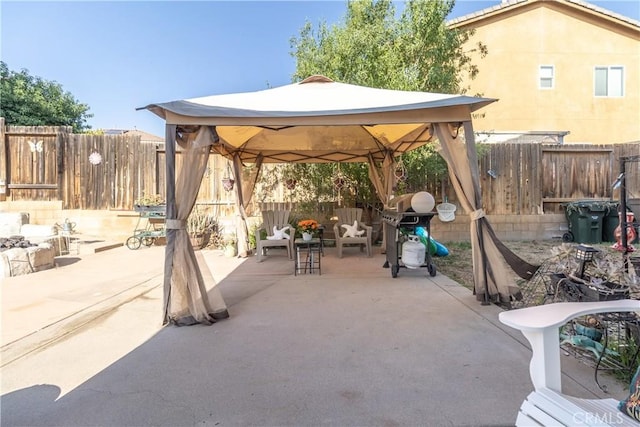 2168 Stonewood St, Mentone, CA 92359 - fenced backyard with a gazebo, a patio area, and a grill