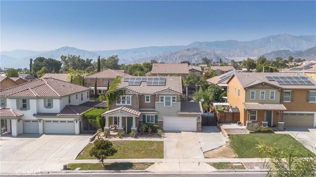 2168 Stonewood St, Mentone, CA 92359 - view of front of house with a residential view, driveway, and a mountain view