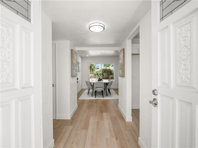 3236 W Browning Ave, Fresno, CA 93711 - foyer entrance featuring light wood-type flooring and a textured ceiling