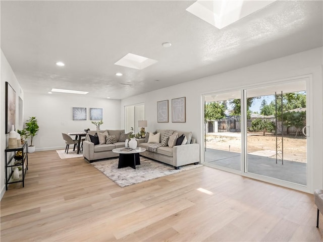 3236 W Browning Ave, Fresno, CA 93711 - living area featuring a skylight, recessed lighting, and light wood finished floors