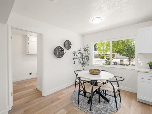 3236 W Browning Ave, Fresno, CA 93711 - dining area featuring light wood-style floors and baseboards