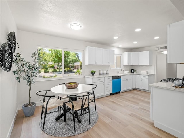 3236 W Browning Ave, Fresno, CA 93711 - kitchen with dishwasher, white cabinets, light wood-style floors, and recessed lighting