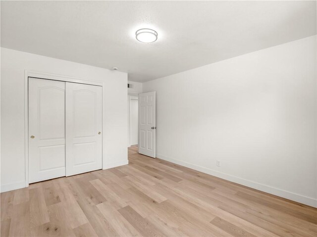 3236 W Browning Ave, Fresno, CA 93711 - unfurnished bedroom featuring light wood-style flooring and a closet