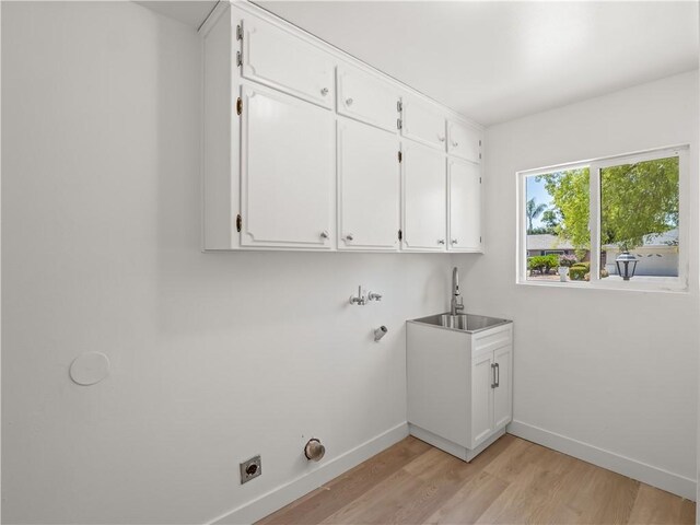 3236 W Browning Ave, Fresno, CA 93711 - laundry area featuring cabinet space, light wood-style floors, electric dryer hookup, bar with sink, and washer hookup