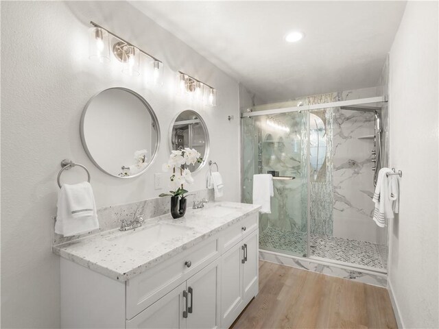 3236 W Browning Ave, Fresno, CA 93711 - bathroom with wood finished floors, double vanity, a marble finish shower, and recessed lighting