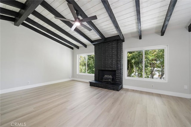 503 Saint Andrews Rd Unit E, Newport Beach, CA 92663 - unfurnished living room featuring light wood-type flooring, a brick fireplace, a ceiling fan, and wood ceiling