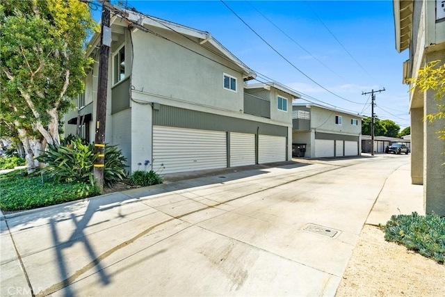 503 Saint Andrews Rd Unit E, Newport Beach, CA 92663 - view of side of property featuring stucco siding