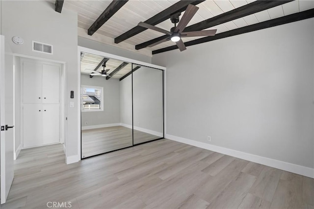 503 Saint Andrews Rd Unit E, Newport Beach, CA 92663 - unfurnished bedroom featuring light wood-type flooring, a closet, a ceiling fan, and a wooden ceiling with exposed beams