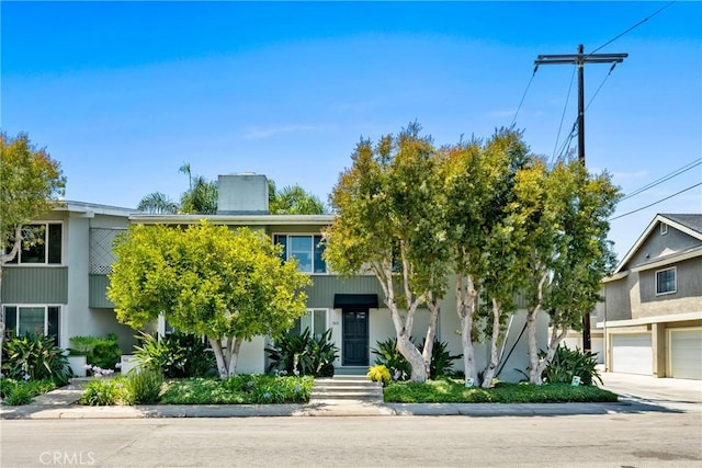 503 Saint Andrews Rd Unit E, Newport Beach, CA 92663 - view of front of house featuring a garage
