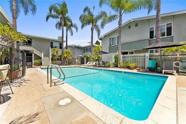 503 Saint Andrews Rd Unit E, Newport Beach, CA 92663 - view of swimming pool with a patio and a residential view