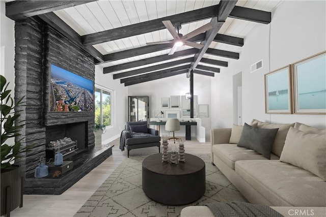 503 Saint Andrews Rd Unit E, Newport Beach, CA 92663 - living area with ceiling fan, beamed ceiling, light wood finished floors, a fireplace, and high vaulted ceiling