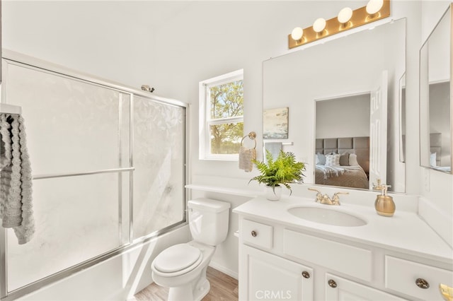 40065 Temple Ct, Murrieta, CA 92563 - bathroom featuring vanity, ensuite bathroom, enclosed tub / shower combo, and wood finished floors