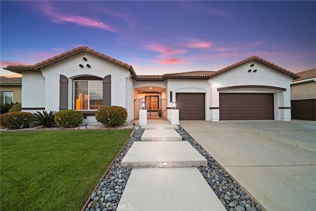 40065 Temple Ct, Murrieta, CA 92563 - mediterranean / spanish house featuring an attached garage, concrete driveway, stucco siding, a yard, and a tile roof