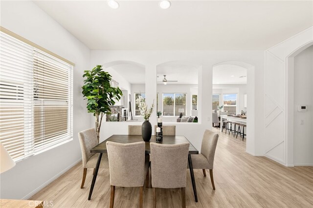 40065 Temple Ct, Murrieta, CA 92563 - dining room featuring light wood-type flooring, arched walkways, ceiling fan, and recessed lighting